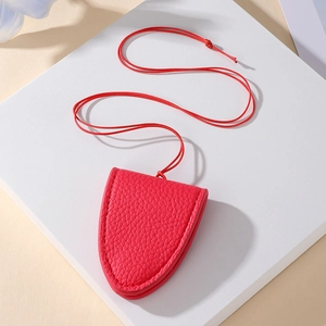 Red lychee grain leather glasses holder necklace with matching lanyard on white steps