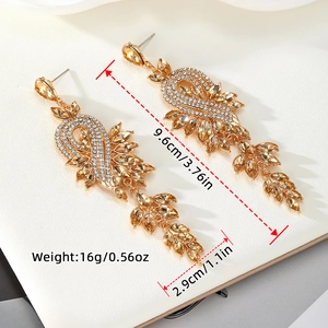Sparkling gold chandelier earrings with champagne marquise crystals and tassels