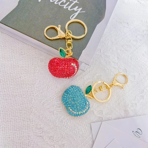 Sparkling apple fruit keychains with red and blue rhinestones on gold alloy rings