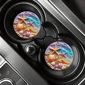 Pair of circular car coasters featuring 3D starfish and shell designs in a cup holder