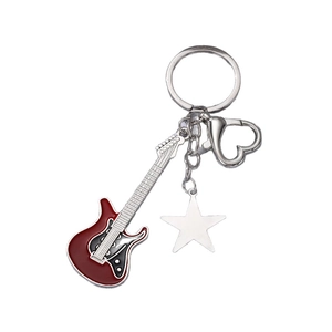 Y2K vintage red electric guitar keychain with metal star charm and heart clasp on white base