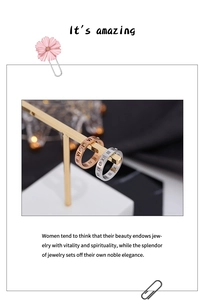 Close-up of rose gold and silver rings with Roman numeral engravings and cubic zirconia