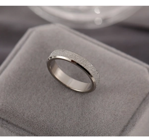 Macro shot of rose gold titanium steel ring with matte finish and polished edges