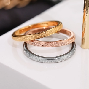 Frosted stackable rings in gold, rose gold, and silver finishes for a modern jewelry look