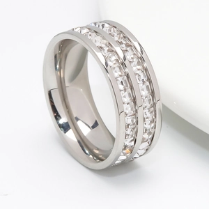 Macro shot of silver stainless steel ring featuring double row square cut clear zircon stones