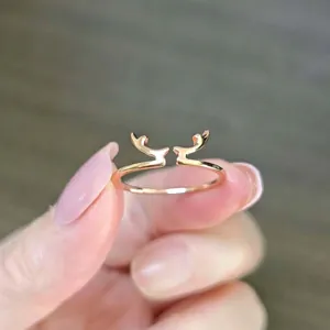 Detail of rose gold reindeer antler open ring showing adjustable thin band design