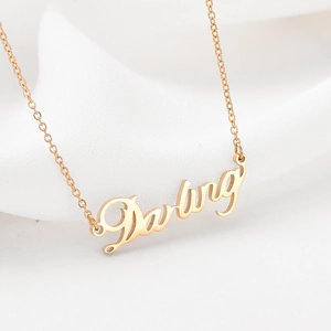 Elegant 14k gold plated stainless steel necklace with Darling letter pendant on white silk