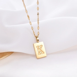 Minimalist 14k gold titanium steel necklace with K letter rectangular pendant on silk