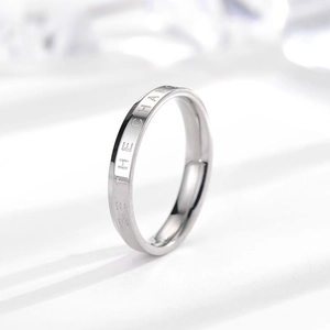 Detail view of silver stainless steel ring with BE THE CHANGE engraving detail