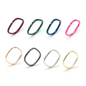 Detail view of 8 colorful square rings with zircon inlay and high polish finish