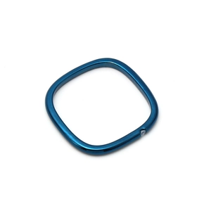 Detail of square blue plated metal ring with single sparkling cubic zirconia stone