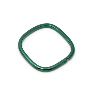 Top view of square copper ring with green finish and small cubic zirconia stone
