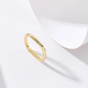 Minimalist square gold ring with single zircon stone for women on white background