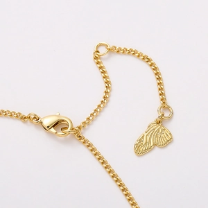 Gold heart lock necklace with butterfly pendant and lobster clasp on white background