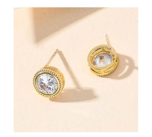 Macro view of gold bezel-set cubic zirconia stud earrings with S925 silver pins