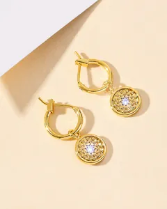 Detail of S925 silver needle drop earring with golden ring and zircon coin pendant