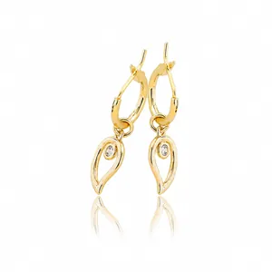 Macro detail of gold teardrop earrings featuring openwork leaf design and zircon stones