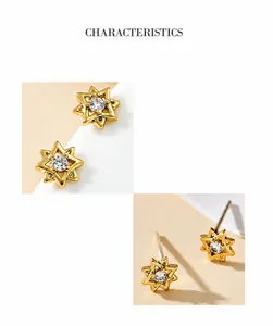 Detail of gold star earrings with double octagonal design and round cubic zirconia center
