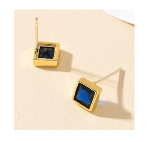 Macro shot of square blue gemstones earrings with gold-plated frames and S925 silver needles