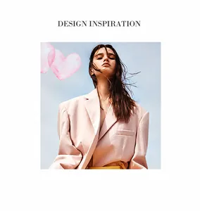 Detail of pink blazer with notched lapels, padded shoulders and tiered pearl choker necklace