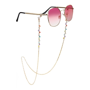 Colorful beaded gold chain on pink gradient sunglasses with bohemian style aesthetic