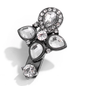 Detailed view of luxury duckbill hair clip with dark metal finish and sparkling crystals