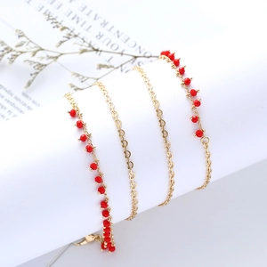 Elegant gold link chain with faceted ruby red beads and lobster clasp for accessories