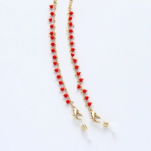 Golden eyewear chain featuring vibrant red beads and secure silicone non-slip loops