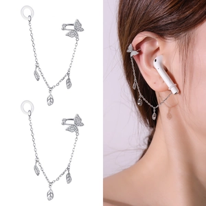 Detail view of silver zircon butterfly ear clip chain with leaf pendants for wireless earbuds