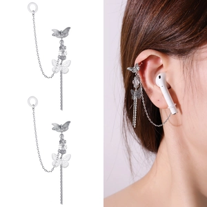 Detail showing butterfly ear cuff with silver chain and silicone anti-lost loop for earphones