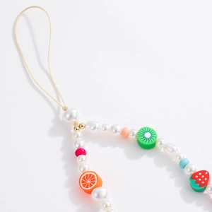 Colorful pearl and fruit clay bead phone lanyard featuring strawberry and kiwi slice charms