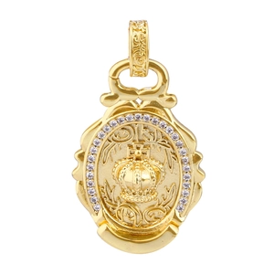 Detail of golden crown pendant featuring a white zircon halo and vintage engraved bail
