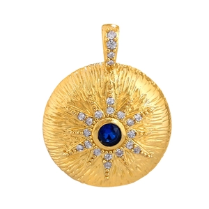 Gold plated starburst pendant featuring a center blue gem and sparkling zircon accents