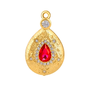 Elegant gold pear-shaped pendant with a large red stone and vintage carved sunburst details