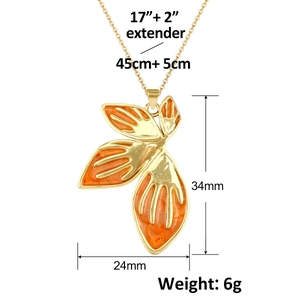 Detailed view of leaf pendant with measurements 34x24mm and adjustable gold chain