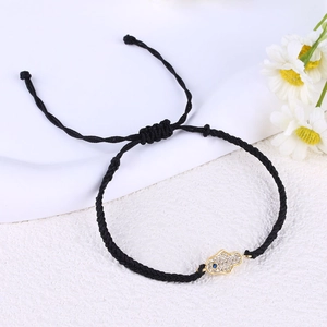 Handmade woven black rope Hamsa Hand bracelet with blue evil eye and sparkling zircons