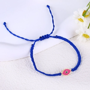 Handmade royal blue woven cord bracelet with pink evil eye charm and gold trim