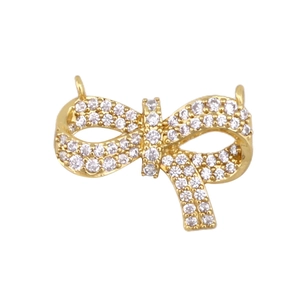 Detailopname van een holle strikhanger met zirkonia en dubbele ophangringen voor sieraden