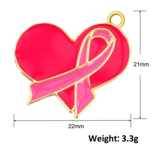 Macro detail of 21x22mm heart pendant with pink ribbon enamel and gold plating