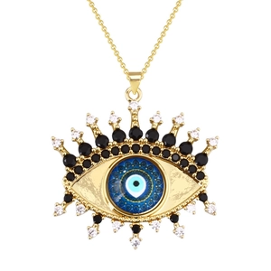 Golden Evil Eye charm necklace with blue glass bead and decorative crystal rhinestones