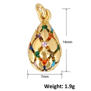 Detailed macro view of gold teardrop pendant with colorful gemstones measuring 14mm by 7mm