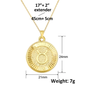 Gold Taurus zodiac coin necklace with minimalist round embossed pendant and cable chain