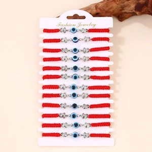 Set di 12 braccialetti intrecciati rossi con perline malocchio e piccoli ciondoli a tartaruga