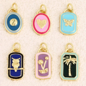 Set of six gold enamel tarot pendants featuring owl heart butterfly and palm tree charms