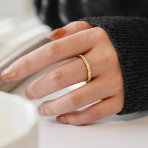 Elegant gold titanium steel eternity ring with shimmering pavé set circular cubic zirconia
