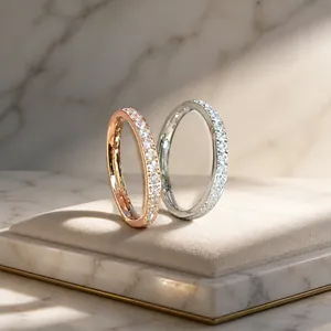 Detail view of rose gold and silver eternity bands featuring pavé set crystals