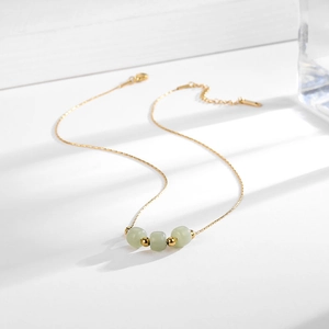 Minimalist 18k gold plated titanium steel necklace with green Hetian jade beads on white