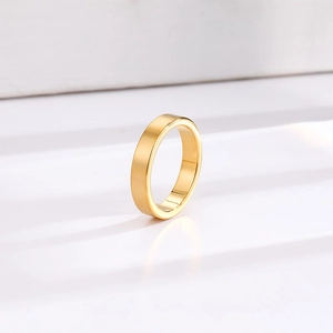 Minimalist 4mm gold polished titanium steel ring with a smooth flat surface finish