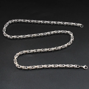 Polished silver Byzantine chain necklace for men with lobster clasp on dark background