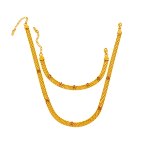Detail view of 18K gold plated mesh chain set with rectangular red zircon stones
